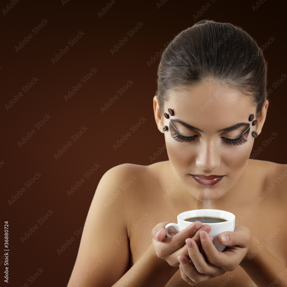 Fototapeta premium teenager girl drinking coffee with beautiful make-up isolated on