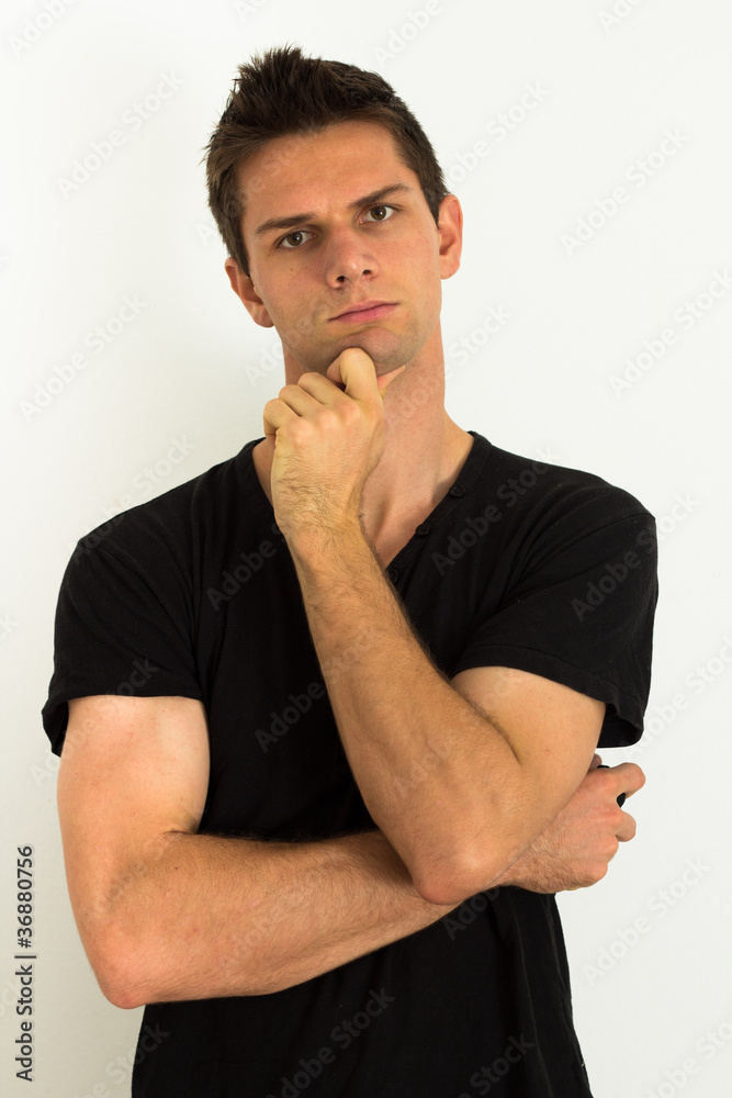 Man thinking with hand on face Man thinking with hand on face