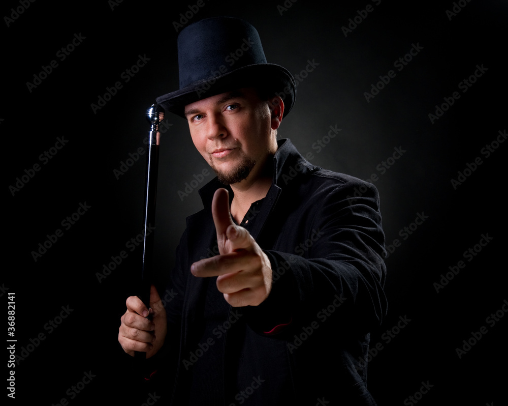 Handsome man wearing black hat and jacket pointing on you Handsome man wearing black hat and jacket pointing on you