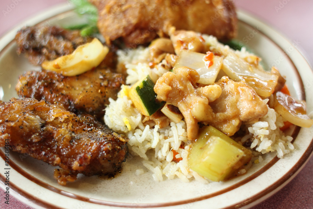 Chinese fried rice with chicken sides. Chinese fried rice with chicken sides.