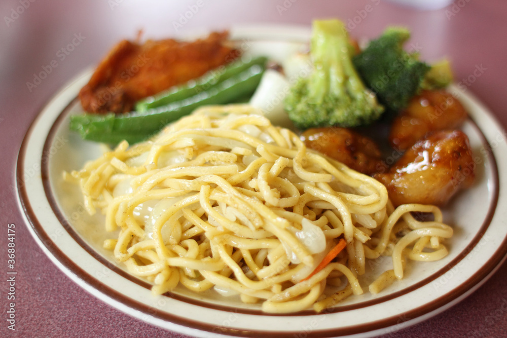 Chinese Chow mein with vegetables and sides. Chinese Chow mein with vegetables and sides.