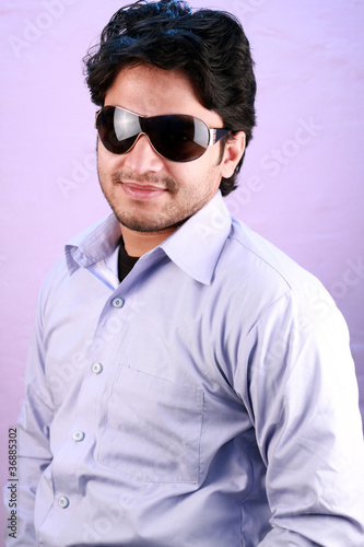 yong indian male model wearing glasses © pathakdesigner