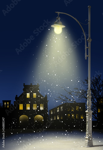 snow falls in the city at night photo