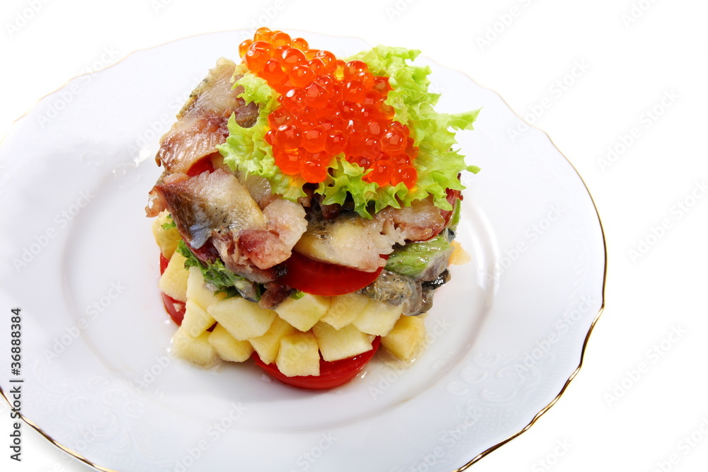 Salad with smoked herring and salmon roe.