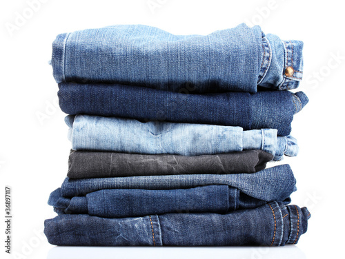 lot of blue jeans isolated on white