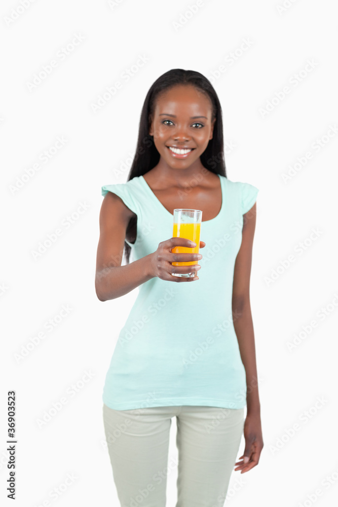 Happy smiling female with a glass of orange juice Happy smiling female with a glass of orange juice