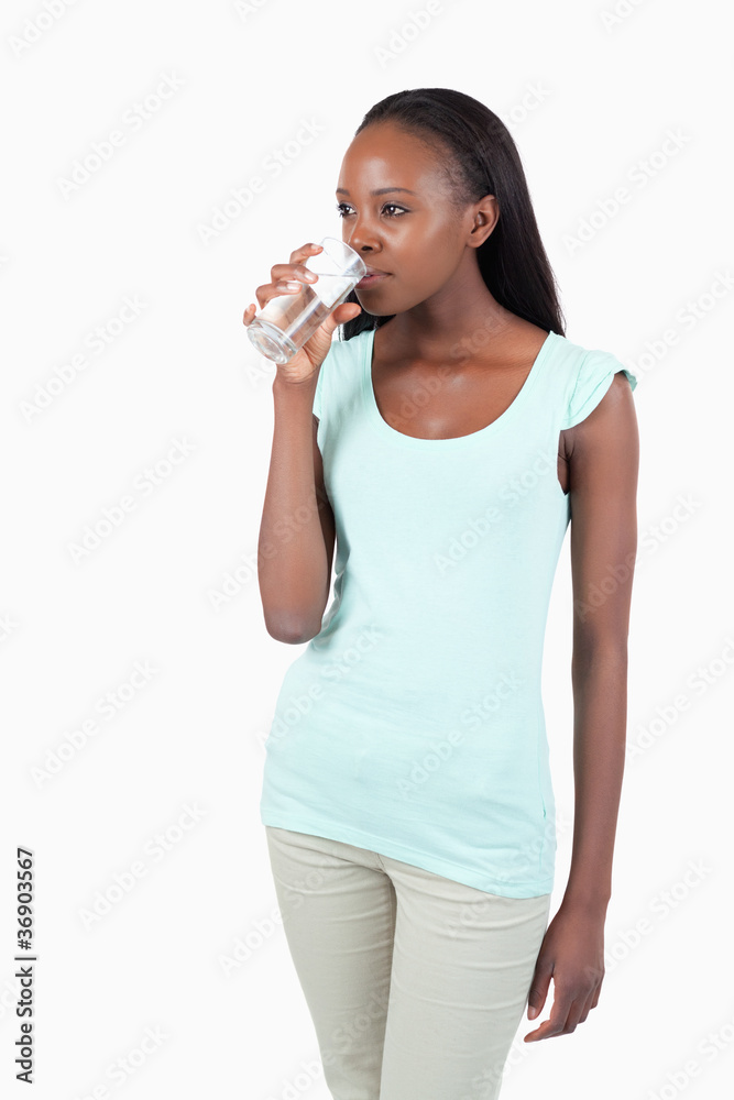 Young female having a sip of water Young female having a sip of water