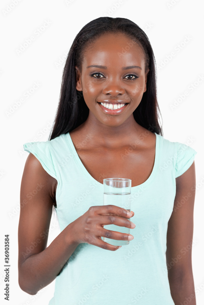 Happy smiling woman with a glass of refreshing water Happy smiling woman with a glass of refreshing water