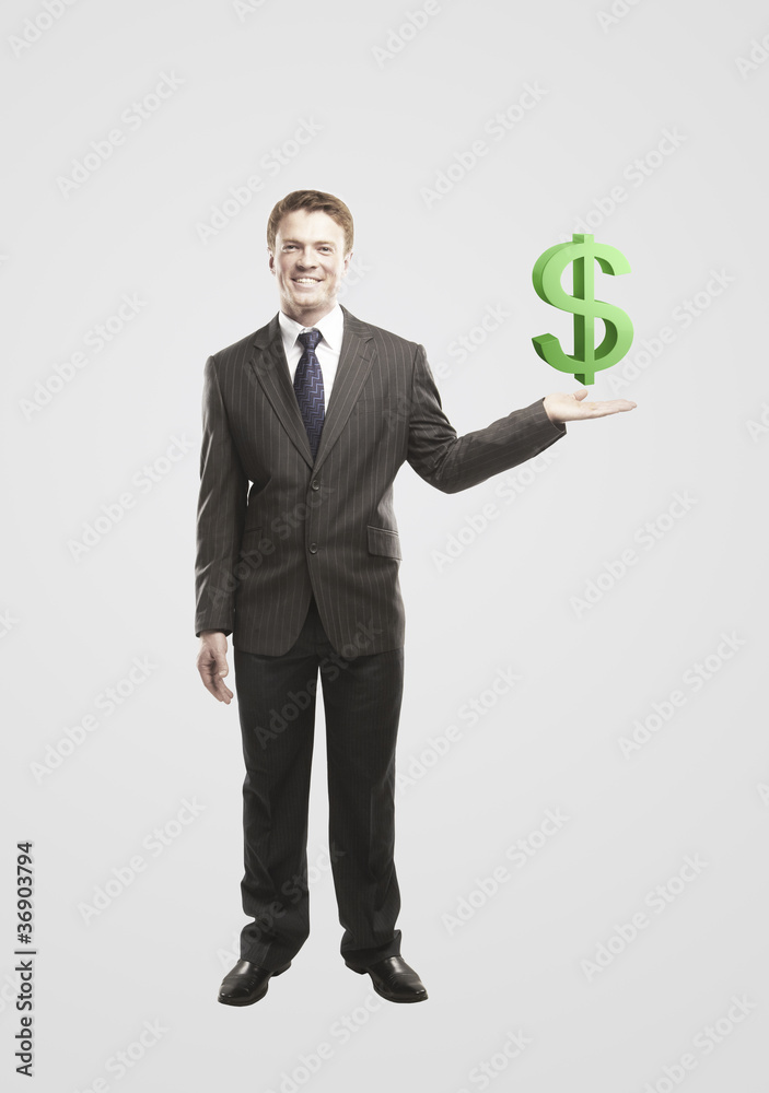Young businessman chooses a green US dollar sign. Young businessman chooses a green US dollar sign.