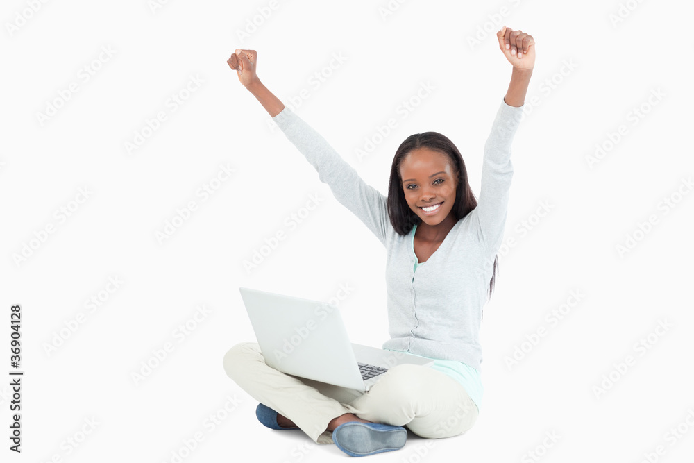 Young woman with notebook on the floor Young woman with notebook on the floor