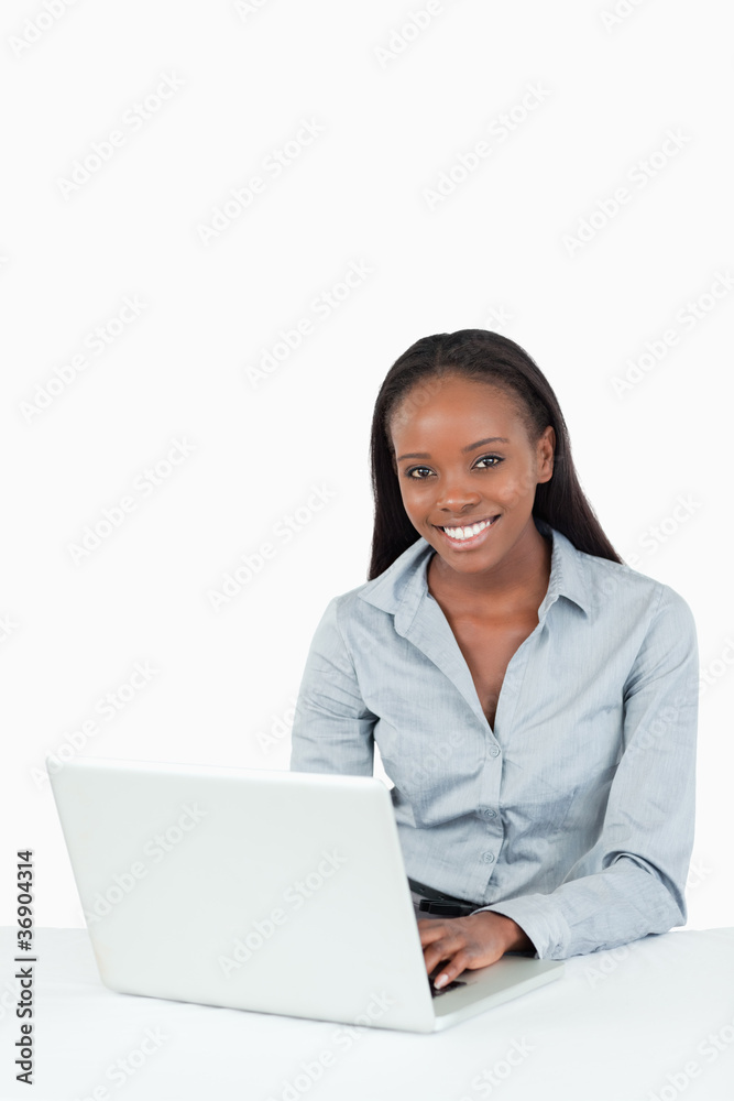 Portrait of a smiling businesswoman using a laptop Portrait of a smiling businesswoman using a laptop