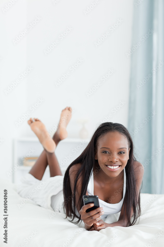 Portrait of a young woman sending text messages Portrait of a young woman sending text messages