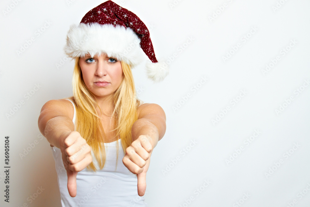 unhappy girl with christmas hat unhappy girl with christmas hat