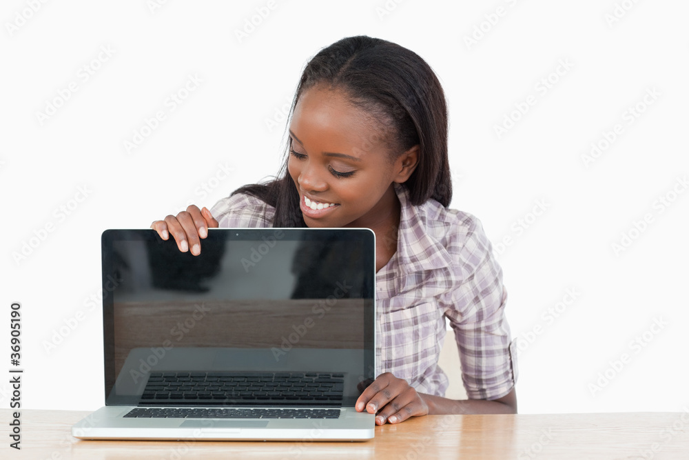 Smiling student woman showing a screen Smiling student woman showing a screen