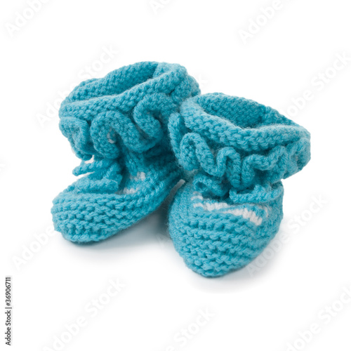 Handmade sweet baby booties isolated on a white