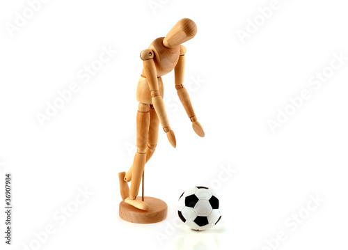 a wooden model is football on a white background