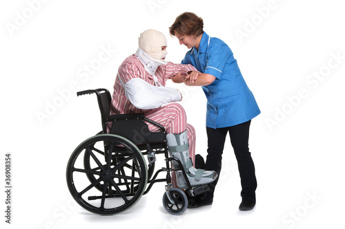 Injured man in wheelchair with nurse