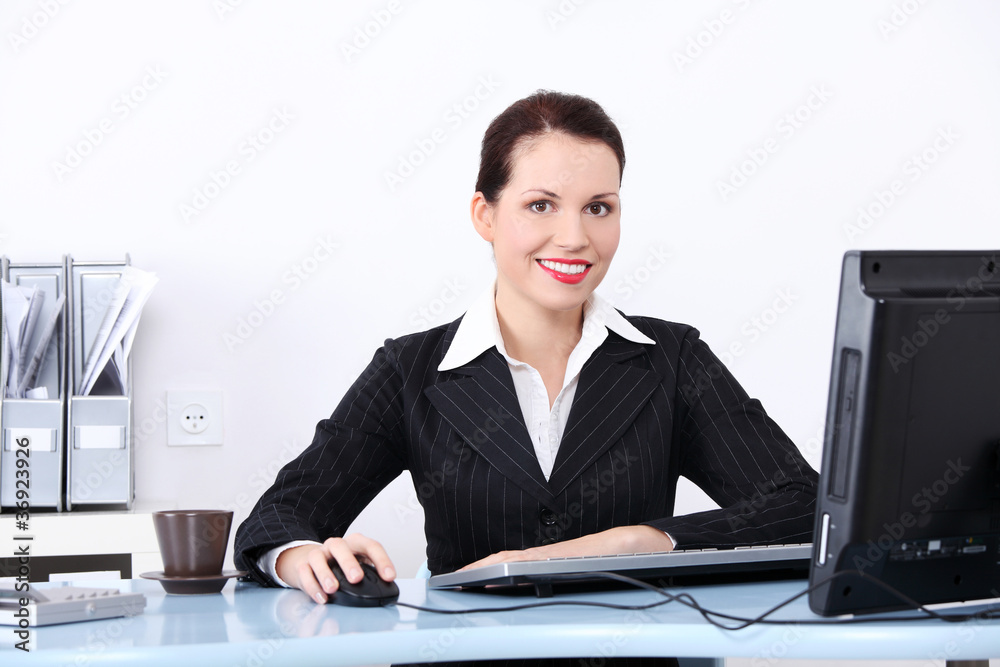 Pretty businesswoman sitting in the office. Pretty businesswoman sitting in the office.