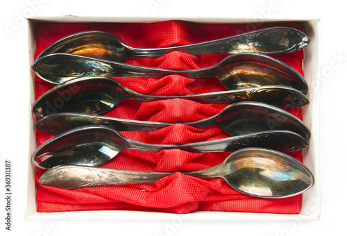 old group of teaspoons in box