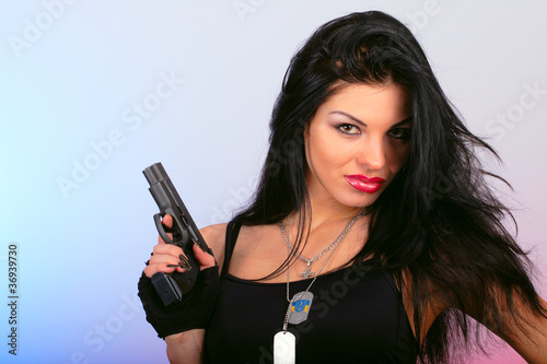 attractive girl with hand gun