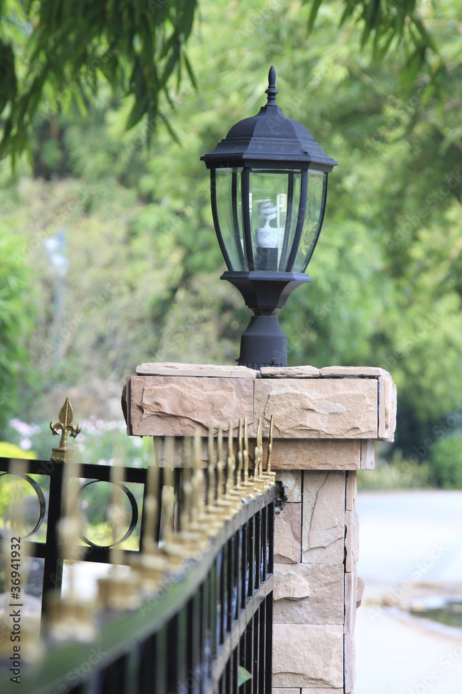 lamp on fence wall