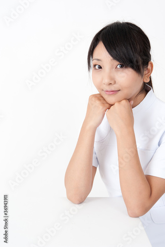 pretty asian nurse sitting