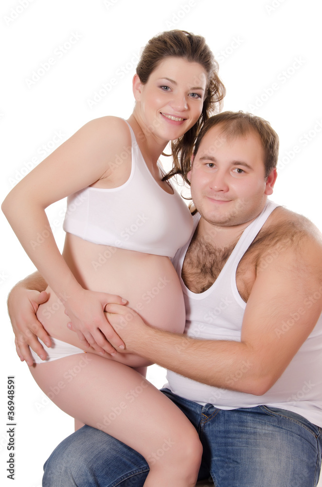 happy pregnant couple isolated on white happy pregnant couple isolated on white