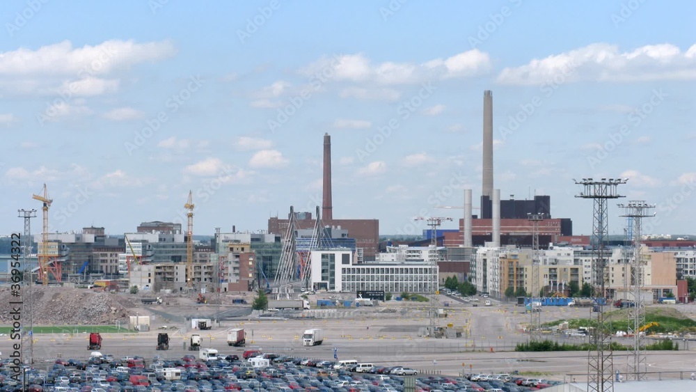Big factory in Helsinki on sunny day, overview, time lapse Big factory in Helsinki on sunny day, overview, time lapse