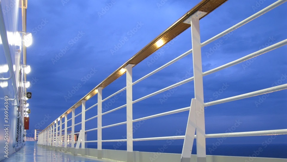 Cruise liner deck at evening time, view from floor