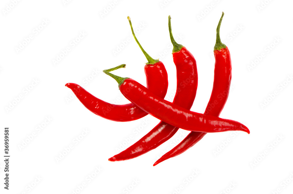 four red chilli peppers on white