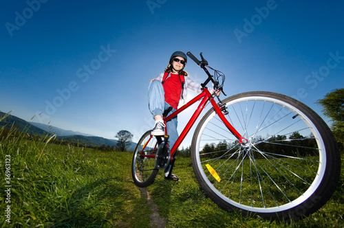 Fototapeta Naklejka Na Ścianę i Meble -  Girl riding bike