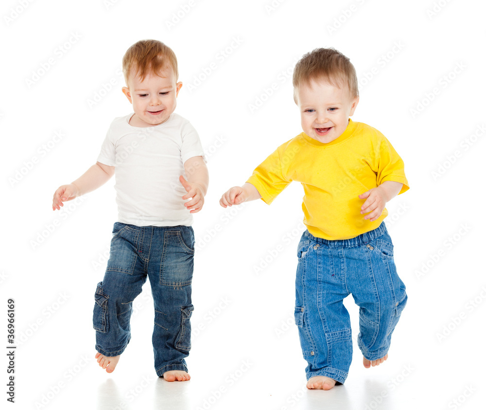 Two little boys playing game and running Two little boys playing game and running