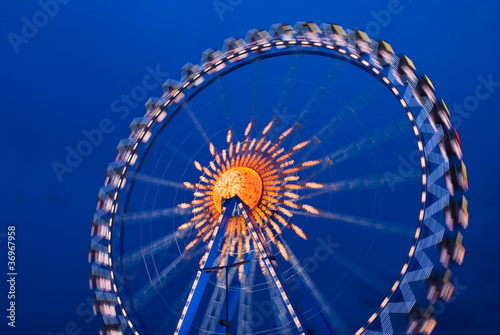 Illuminated Ferris wheel at the oktoberfest