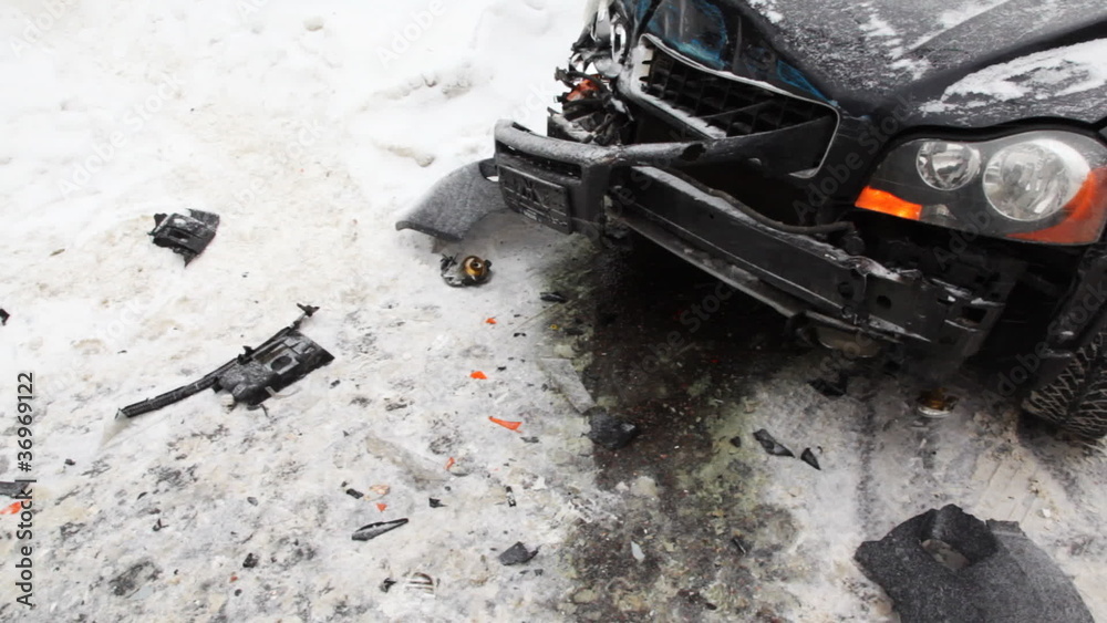 smashed car after accident on road with tram