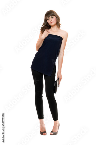 Beautiful girl in a black leggings. Isolated