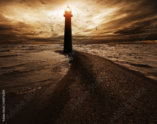 Fotografie Stormy sky over  lighthouse