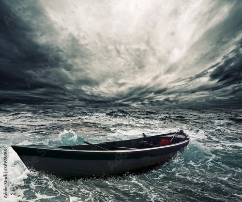 Abandoned boat in stormy sea