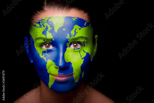Girl with a painted map of World on his face.