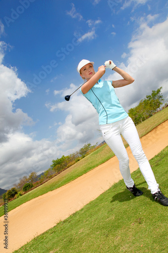 Portrait of woman playing golf