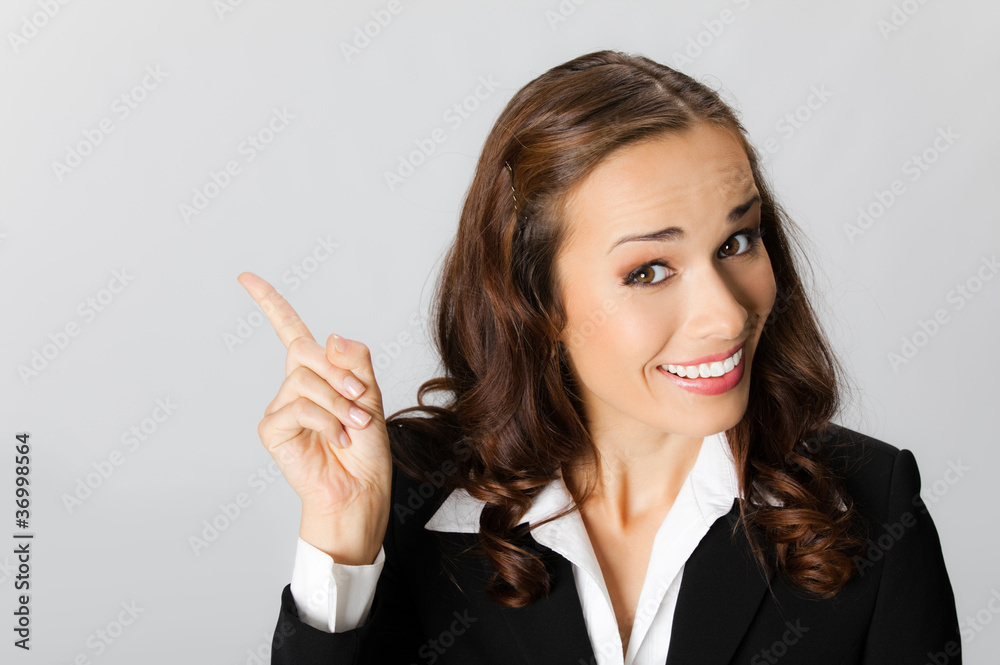 Businesswoman showing blank area for sign Businesswoman showing blank area for sign