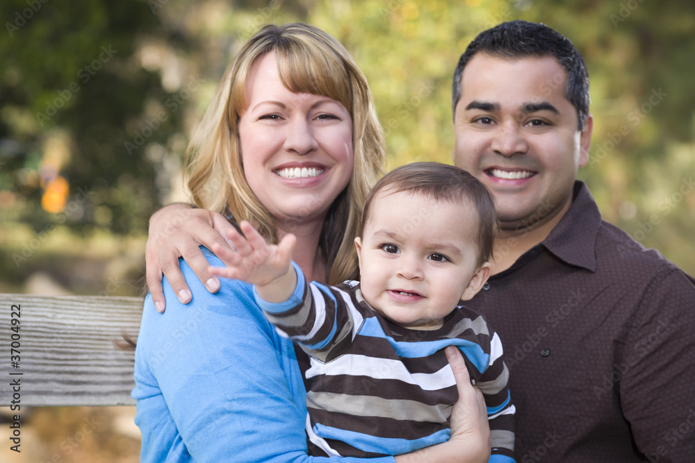 Happy Mixed Race Ethnic Family Posing for A Portrait Happy Mixed Race Ethnic Family Posing for A Portrait