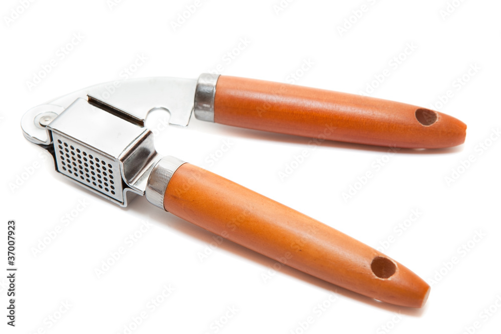 Garlic presser isolated on a white background.