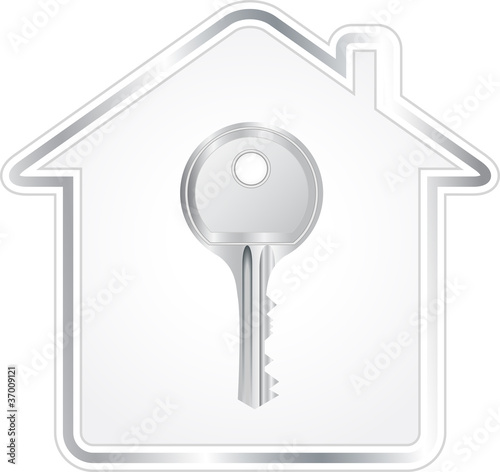 beautiful silver key in metallic house silhouette