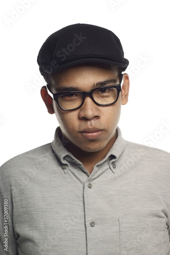 Billede på lærred Asian malay man looking at you with firm stare