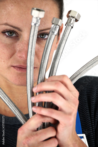 Woman with metal flexible hoses