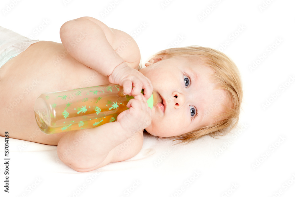 adorable child drinking from bottle. 6 months old girl. adorable child drinking from bottle. 6 months old girl.