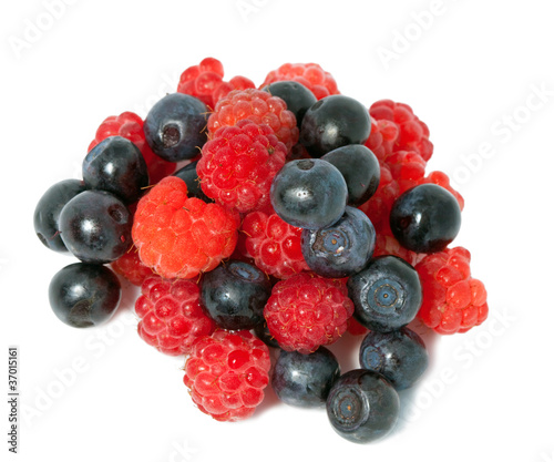 berries of raspberry and bilberry on white background