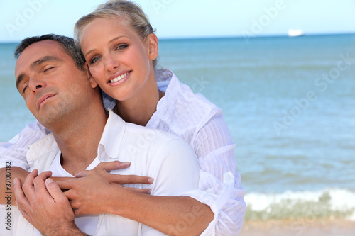 Loving couple on a beach © auremar