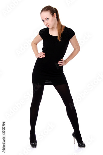 young woman in black dress. Isolated over white background.