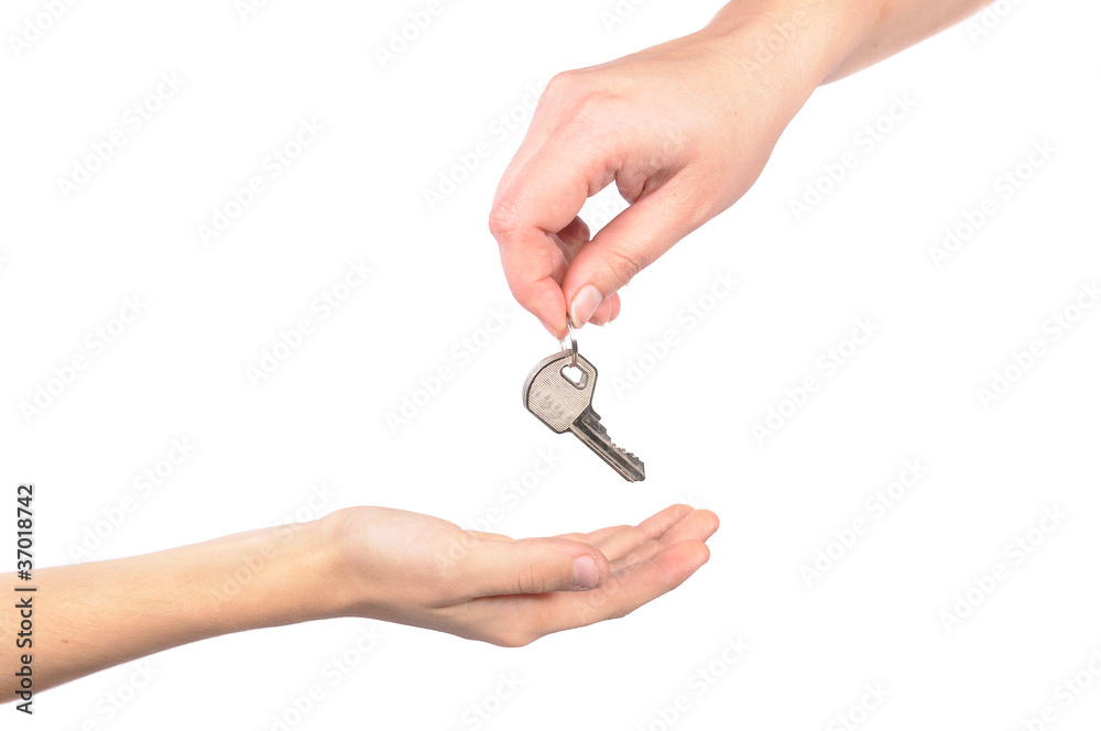 photo handing over a key female hand holding a key and handing i